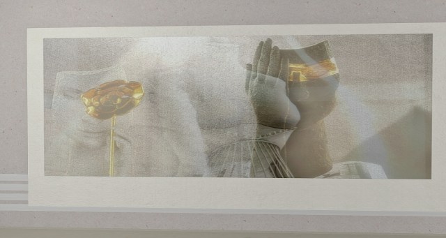 Julana Allen’s artwork Spirit of Imago at IMAGO in Second Life — a textured, minimalist composition featuring a golden rose and hands in quiet reflection. Photographed by Owl Dragonash.