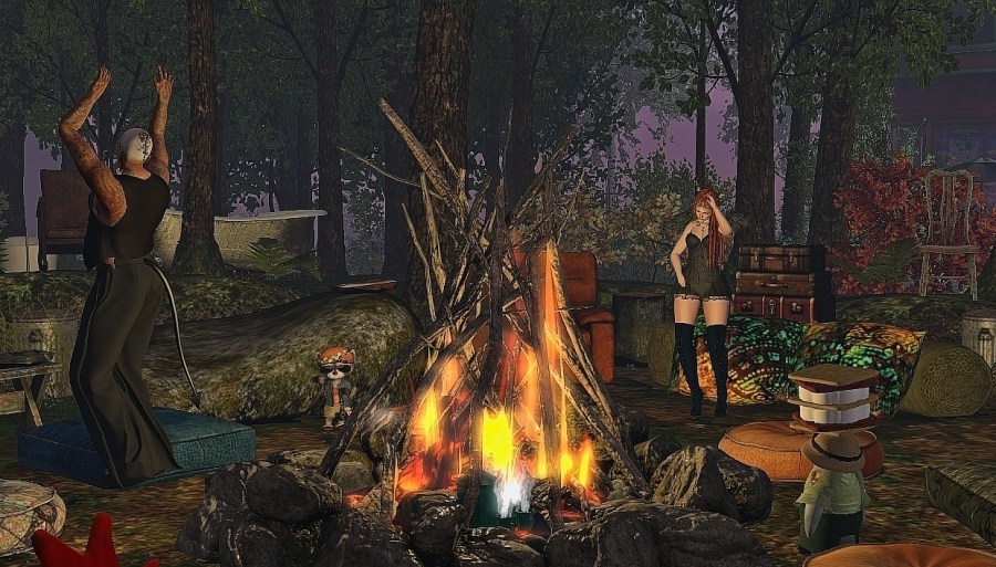Avatars gathered around a fire at No Dumpire in Second Life, a junktopian community created by No Dumperor Zed
