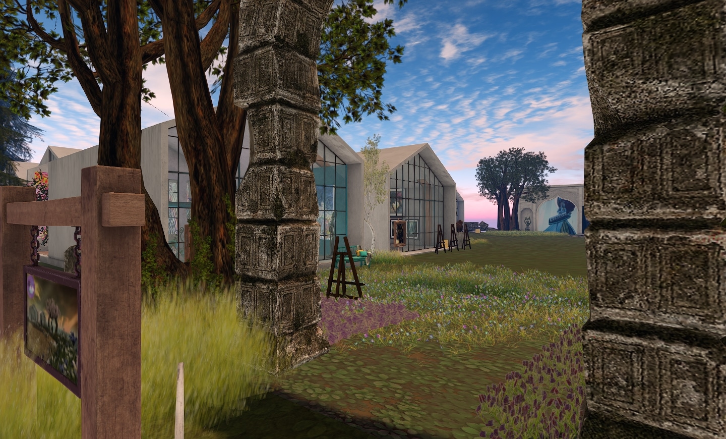 Stone pillars frame the walkway at cloud galleries in second life during the april art walk 2026, with glass-front gallery spaces and outdoor easels visible along the corridor.